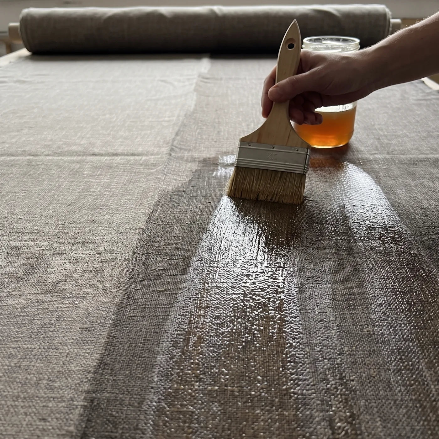 Applying a Layer of Natural Glue to Linen Canvas